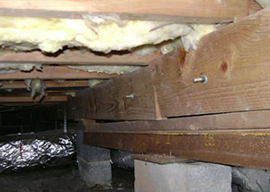 sagging crawl space with wooden shimming a Kings Beach crawl space