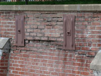 A collapsing, crumbling retaining wall in Homewood
