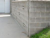 A retaining wall separating from the adjoining walls in Tahoe Vista
