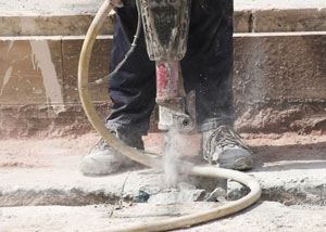Jackhammering a slab floor in a Incline Village home.