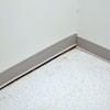 A partition wall separating from the floor in a Wellington home.