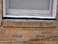 A window sill cracking and separating from the foundation wall in a Zephyr Cove home.