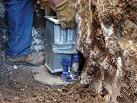 Securing a foundation footing bracket for a foundation repair system in Yerington.