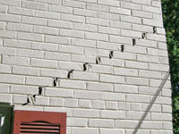 Stair-step cracks showing in a home foundation in Tahoma