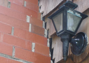 A tilting chimney in Washoe Valley showing serious foundation damage.