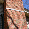A tilting chimney on a Homewood home with a leaning, tilting chimney that was temporarily repaired.
