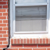 A gap in a window along the outer wall due to foundation settlement of a Kings Beach home.