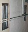 Foundation wall anchor plates installed in a basement in Truckee