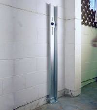 A failing foundation wall repaired with a foundation wall channel anchor system in a Carson City home.
