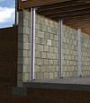 I-beam foundation wall supports installed in a Homewood basement.