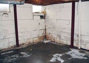 A failed, rusty i-beam foundation wall system installed in Genoa.