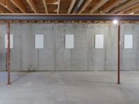 A repaired basement wall with foundation wall anchor covers installed in Incline Village.