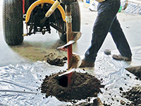 Digging the hole used for wall anchor installation in Zephyr Cove.