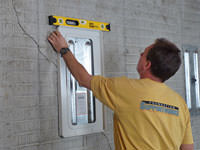 Positioning a wall plate cover on a foundation wall in Gardnerville.